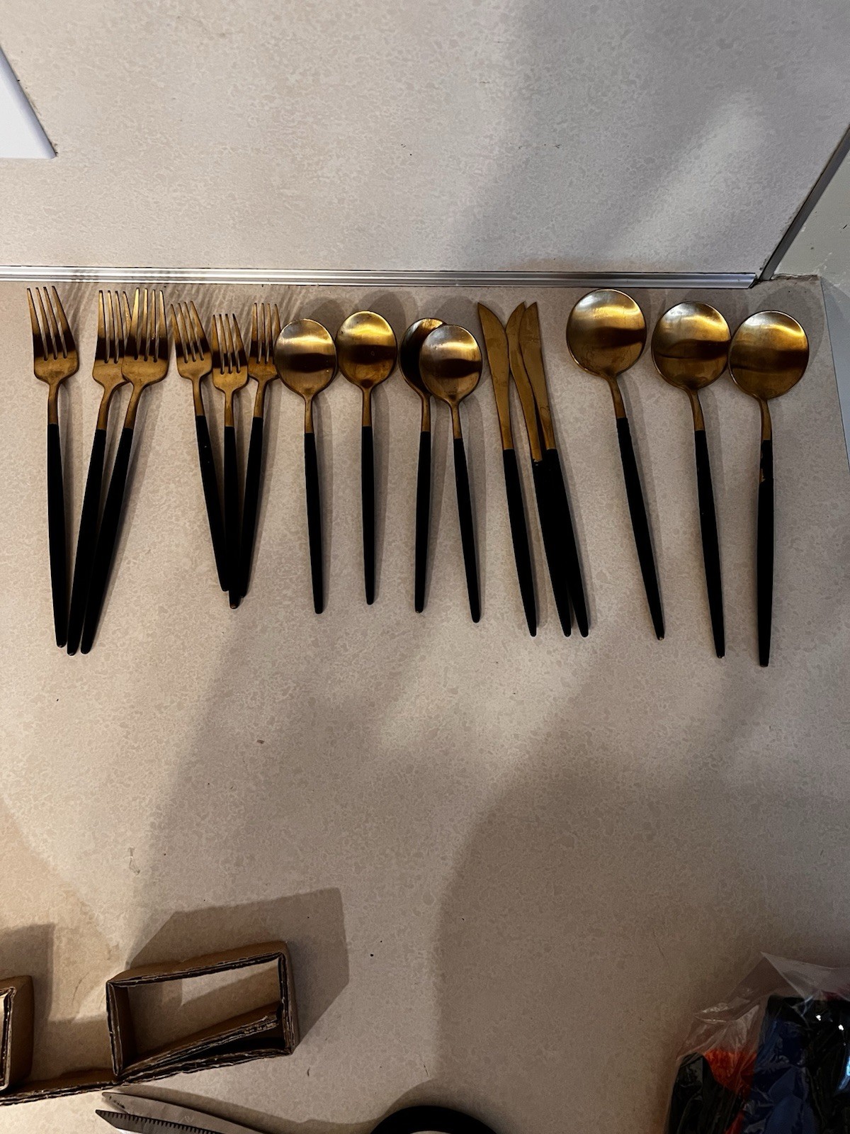 Gold Flatware With Black Handles Sleek Design.  16 Pc  Photos Show Wear