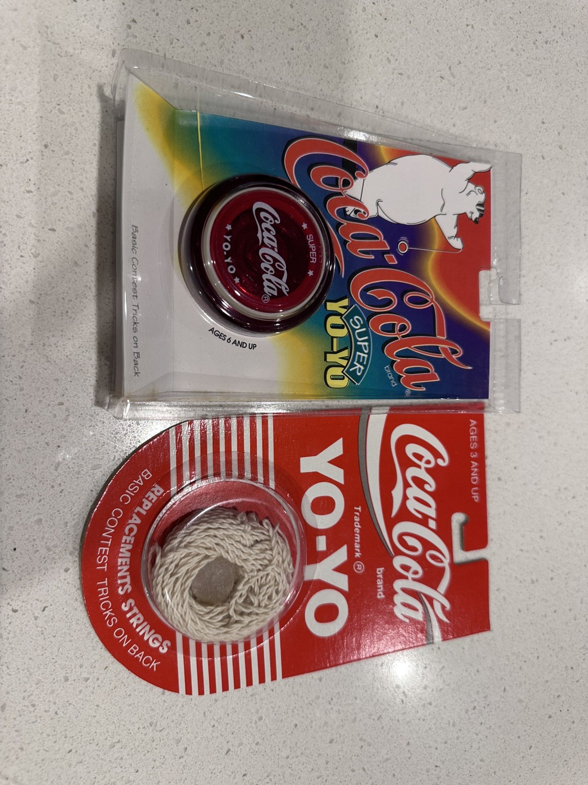 2x 1990 Red Coca Cola Yoyo Clear with 2 packs of 6 strings and Wax