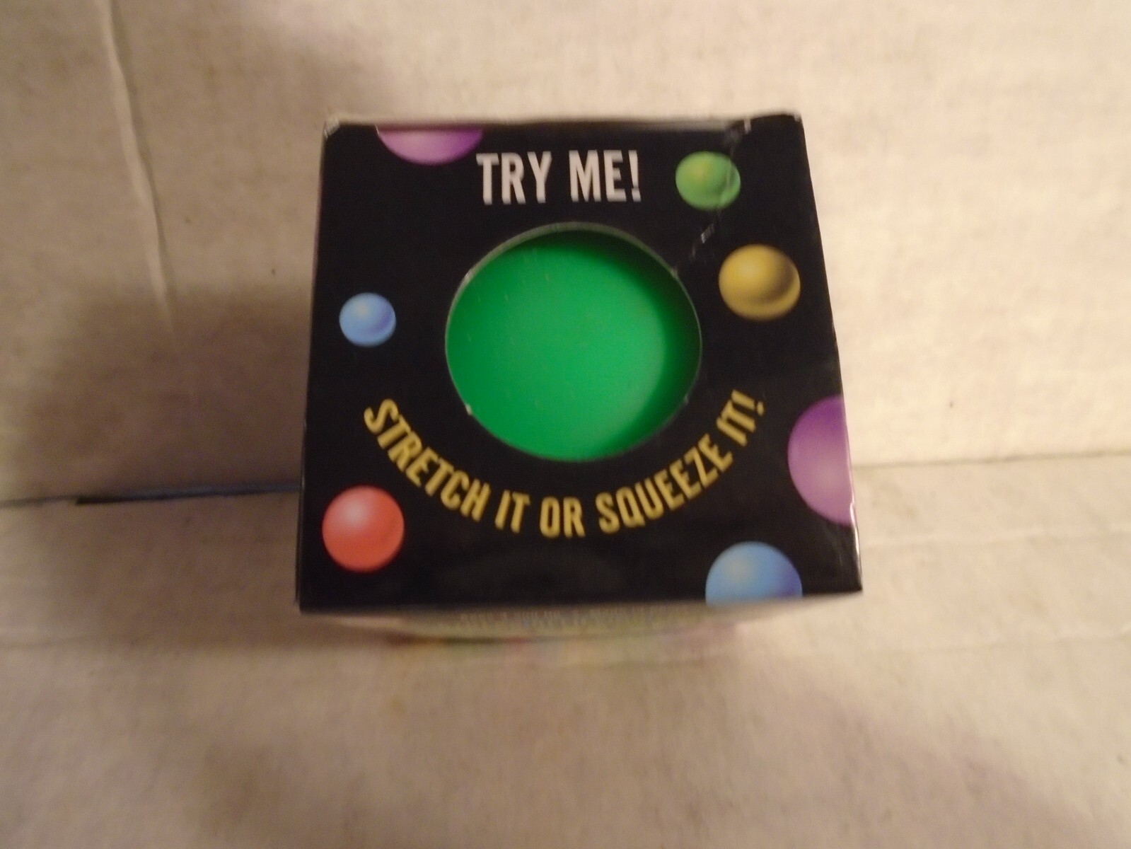 Squish Stretch Ball- Green stress relieving fun. In box, stretch/squeeze, squish