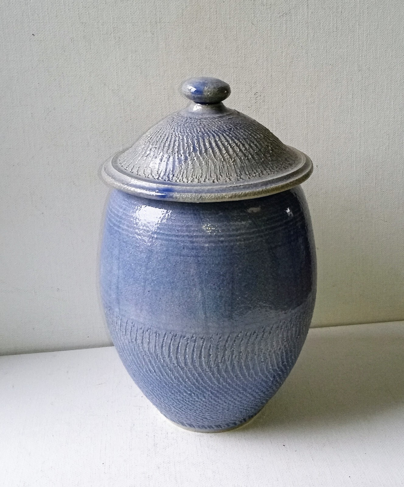 Bowring Ceramics Ginger Jar with lid. Light blue with impressed design.
