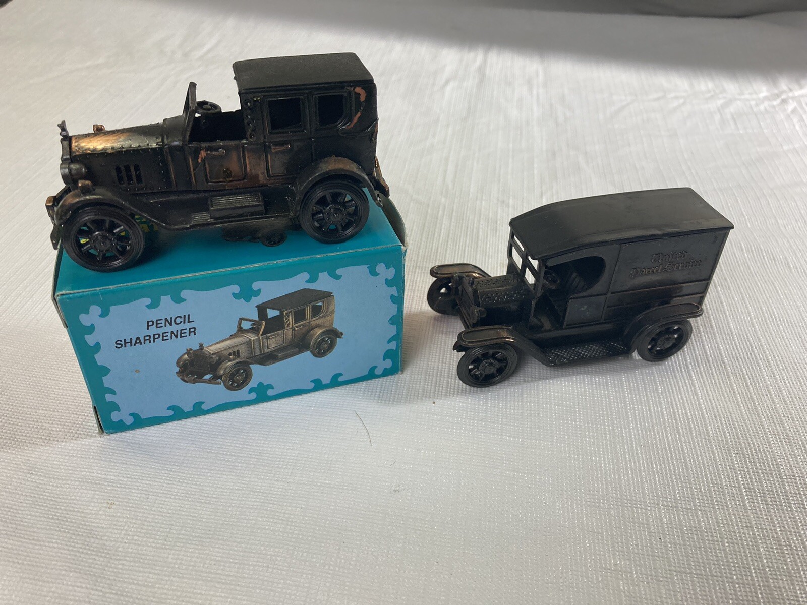 Vintage Die Cast Metal Car And UPS Truck Pencil Sharpeners.