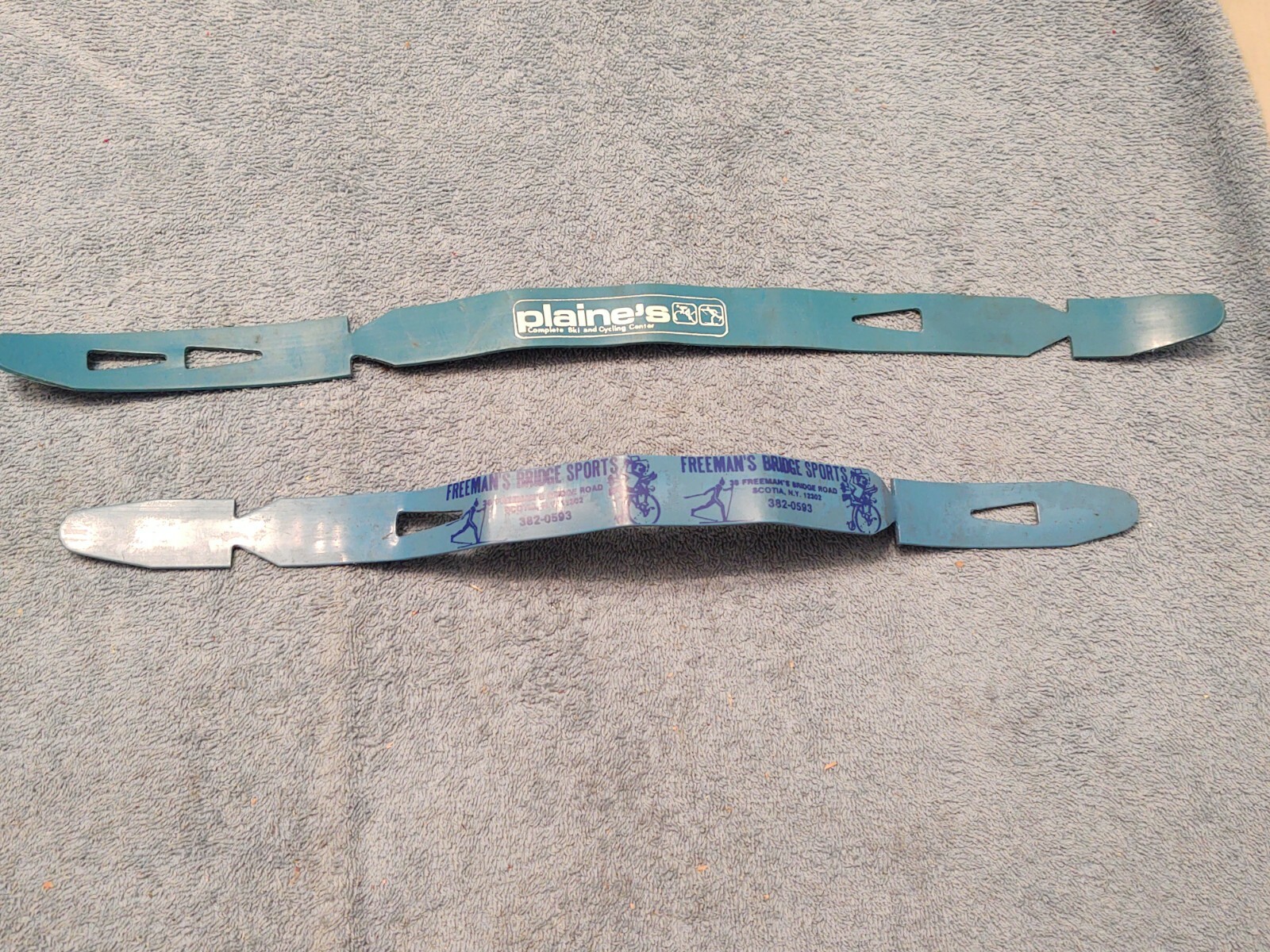 Ski Strap Fasteners To Make Carrying Skis Easier advertising