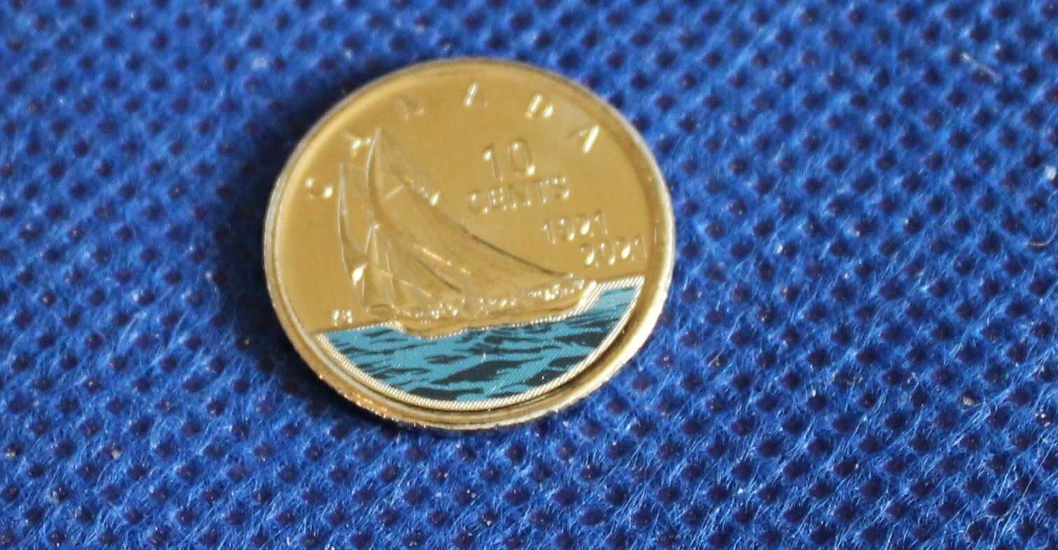 2022 Canada First Strike Unc. Loonie Direct from Roll also 2021 colored Dime
