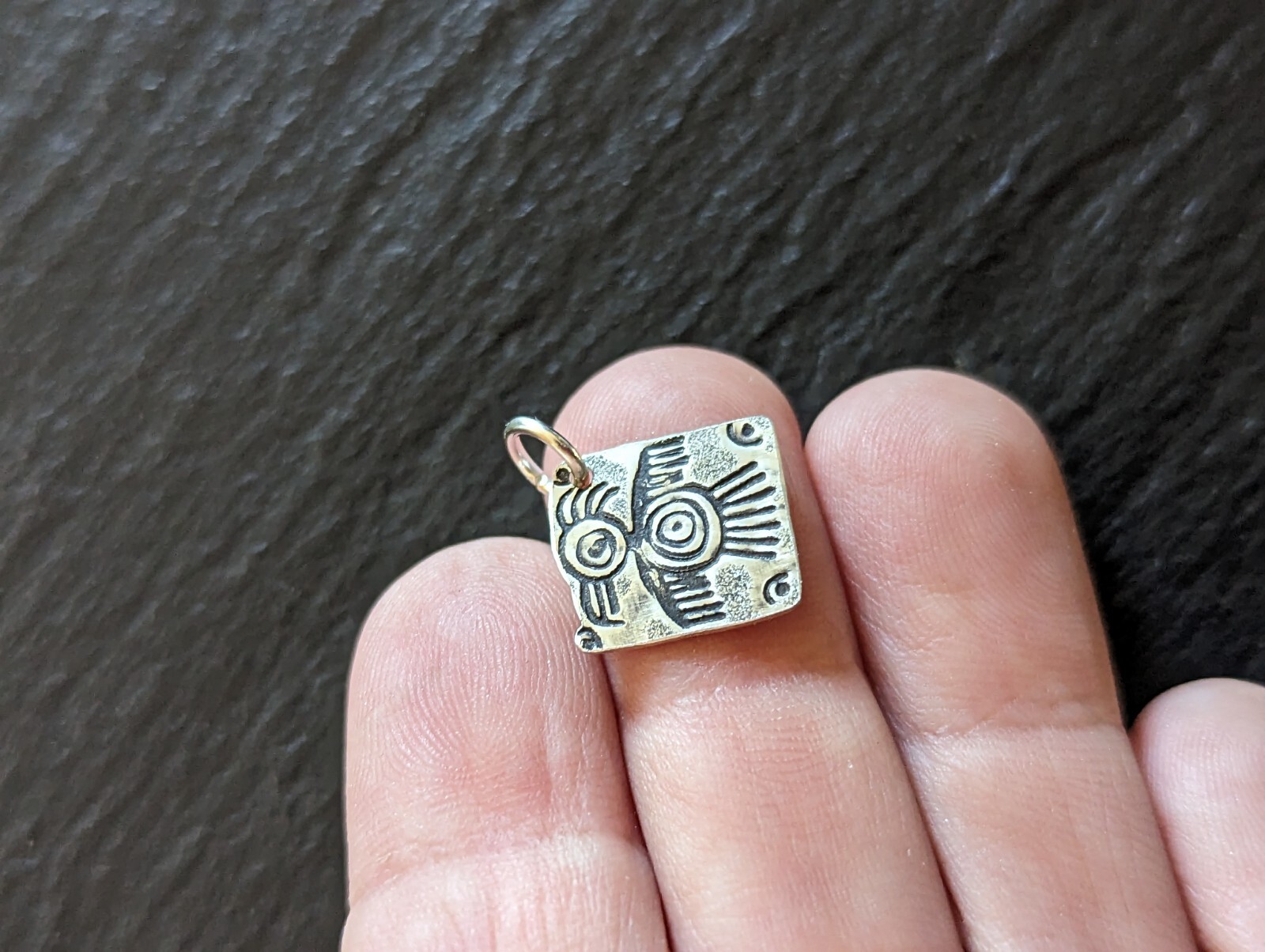 Tiny sterling silver charm with a bird sumbol - handmade - freeform