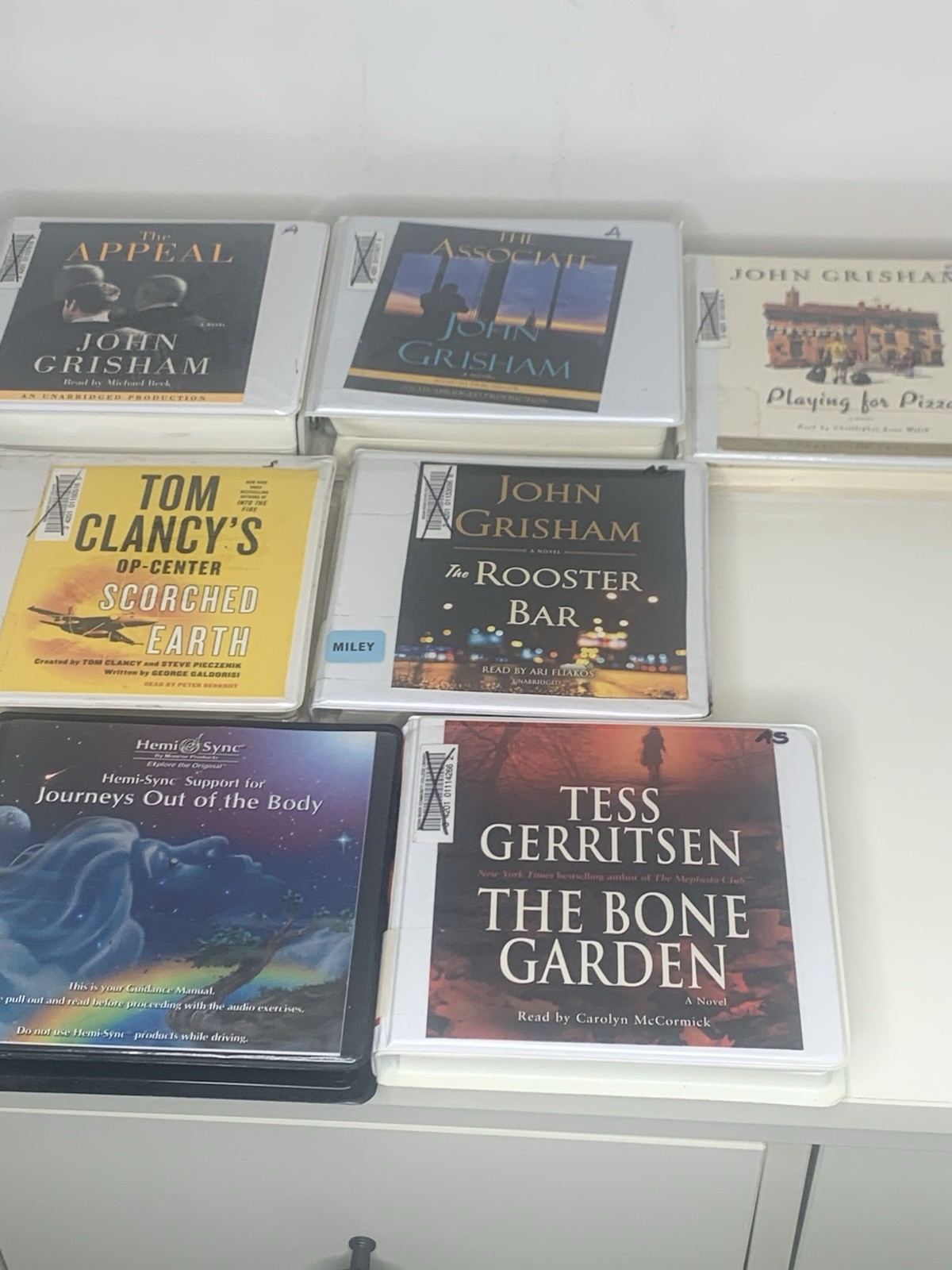 7 Books On CD John Grisham, Tom Clancy, Tess Gerritsen See Pictures For Titles