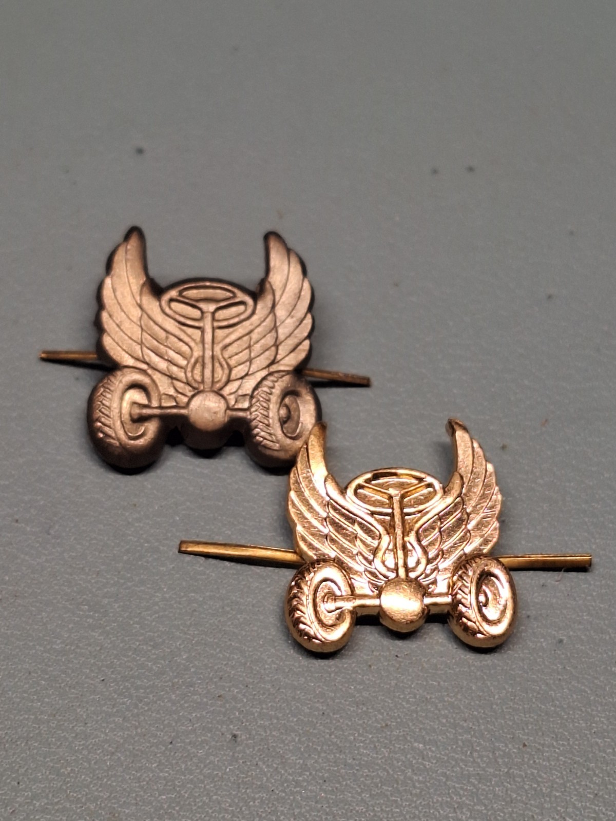 MILITARY AUTOMOTIVE TROOPPS BUTTON HOLE EMBLEMS ONE SILVER TONE ONE IS GOLDEN...