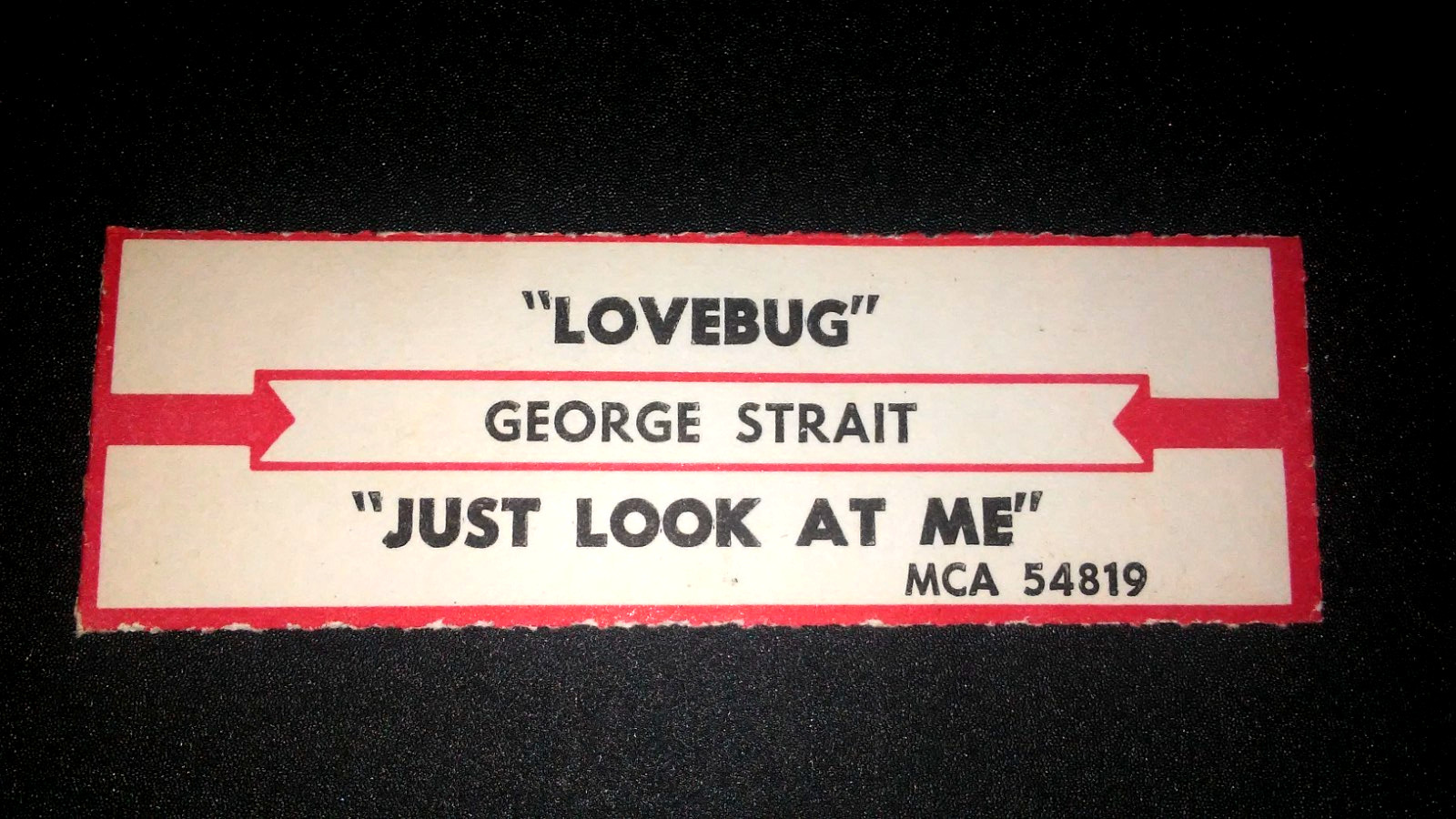 JUKEBOX STRIP (1)  GEORGE STRAIT Love bug/Just Look At Me 45 L@@K!