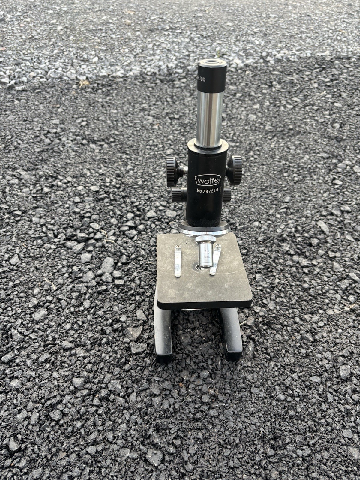This is a vintage Wolfe student microscope likely imported from Japan,