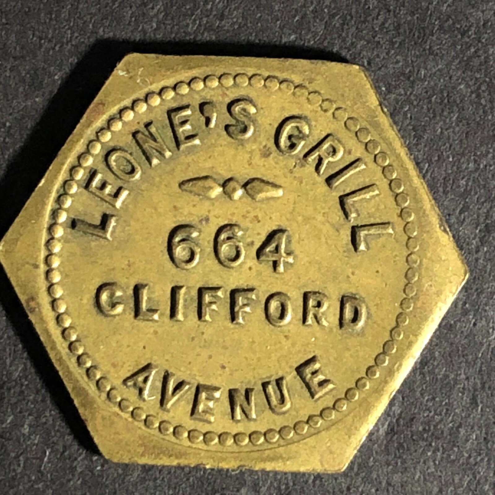 Leone's Grill (Rochester, NY) Brass Token - 20mm Hexagon c1944-48