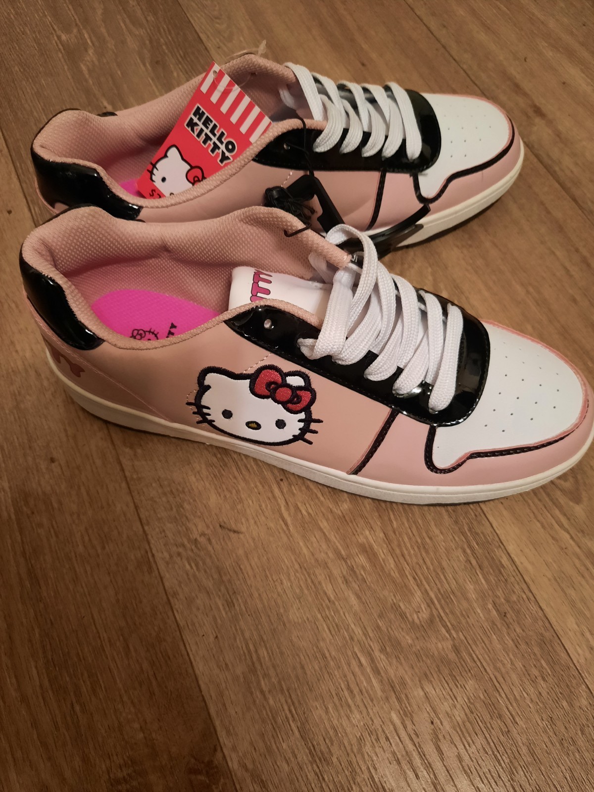 Women's Hello Kitty NWT size 11 Sneakers Pink And Black