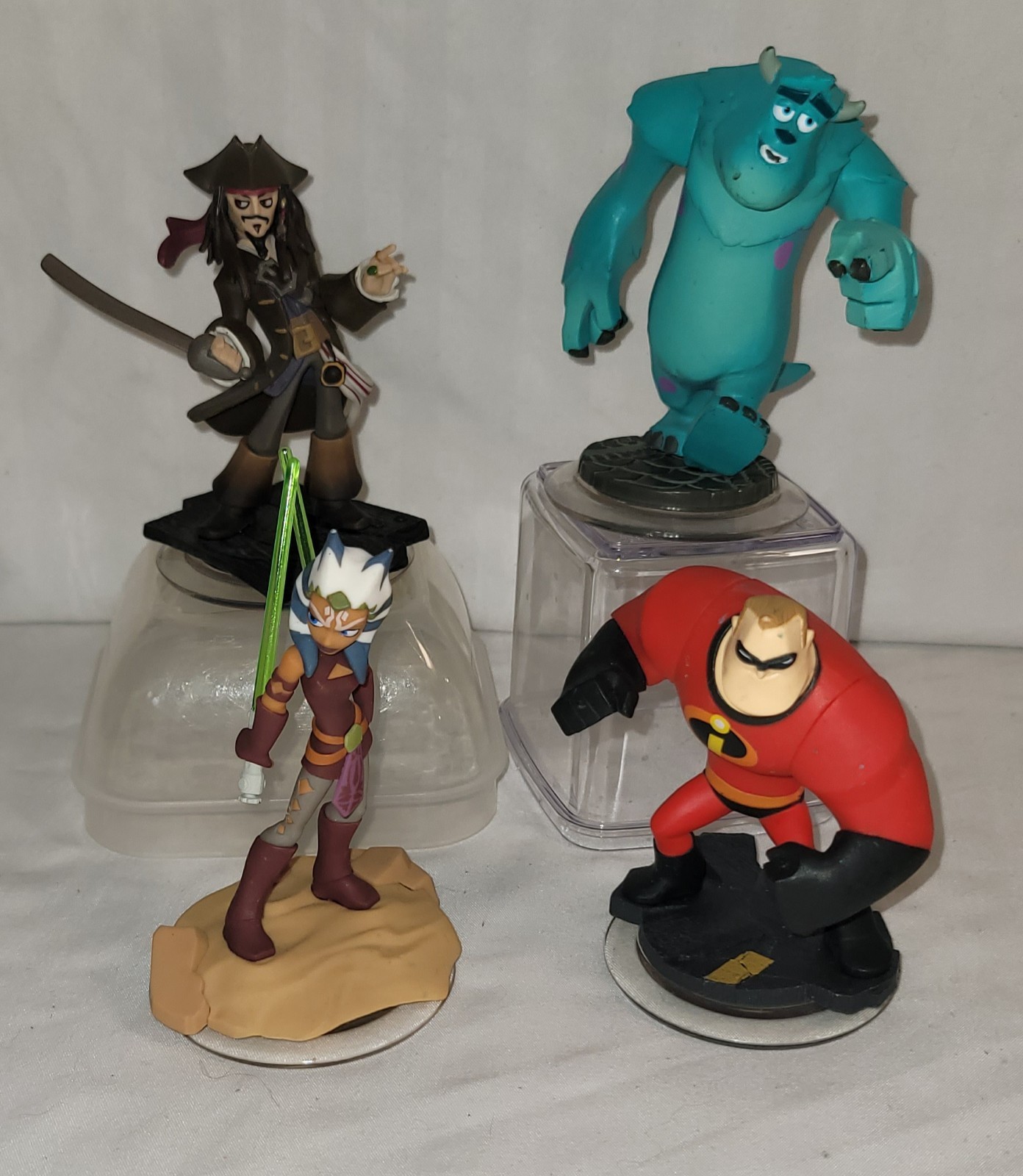 DISNEY INFINITY Playstation Xbox Wii Lot 4 Monsters Star Wars Pirates Incredible