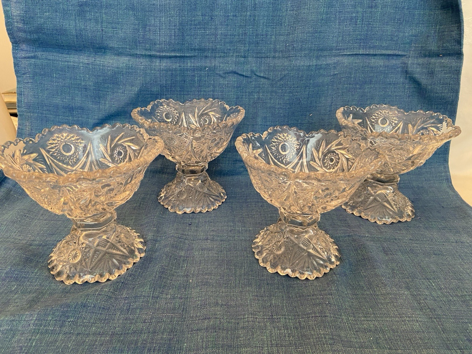 Vint Set of 4 PRESSED GLASS PEDESTAL COMPOTES Stars Flowers Sawtooth Edge 4 3/4"